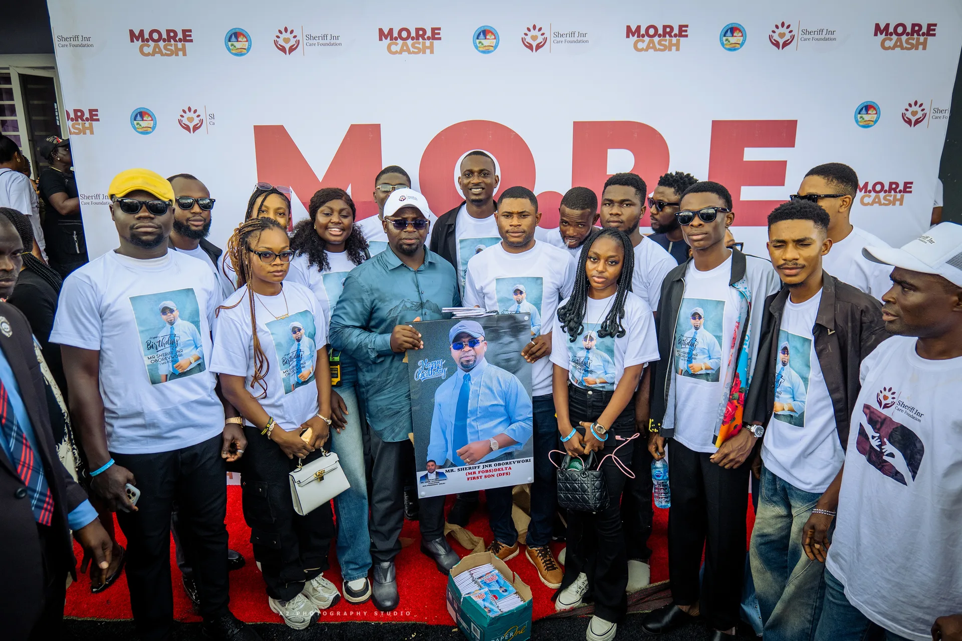 A group photograph at the event backdrop.